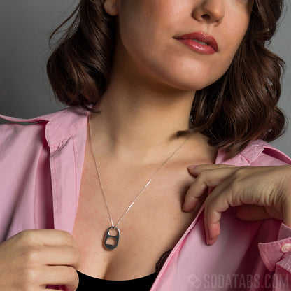 Woman with red lipstick wearing silver Soda Tab pendant on a silver chain